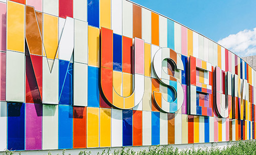 Colourful building wall which says Museum on it.